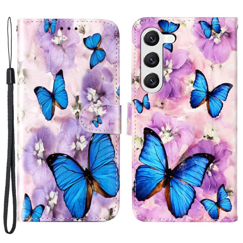 Housse Samsung Galaxy S24 Plus 5G Papillons Bleus et Fleurs Violettes à Lanière