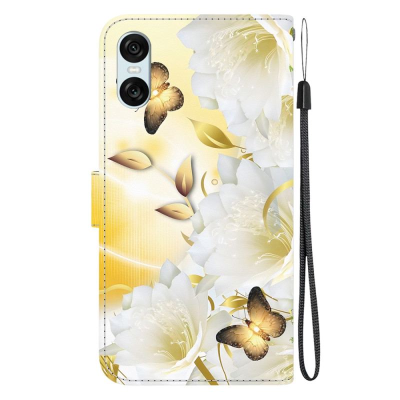 Housse Sony Xperia 10 VI Papillons Dorés et Fleurs Blanches à Lanière