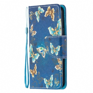 Housse iPhone 12 Mini Papillons et Fleurs Bleus à Lanière