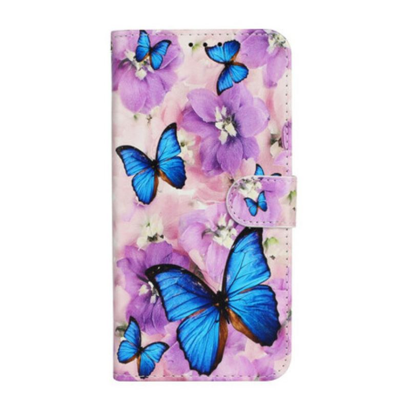 Housse iPhone 13 Mini Papillons Bleus dans les Fleurs