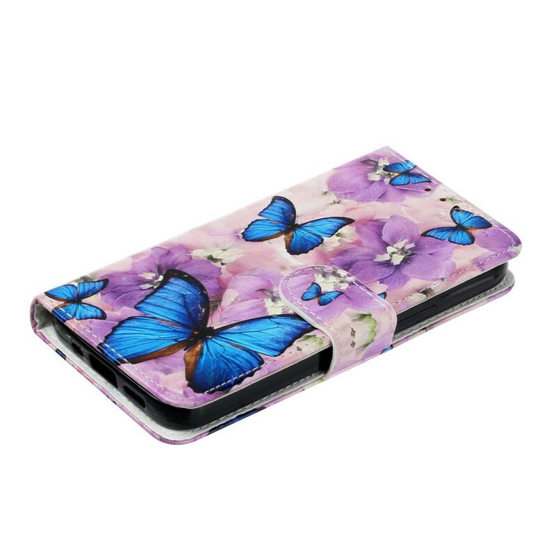 Housse iPhone 13 Mini Papillons Bleus dans les Fleurs